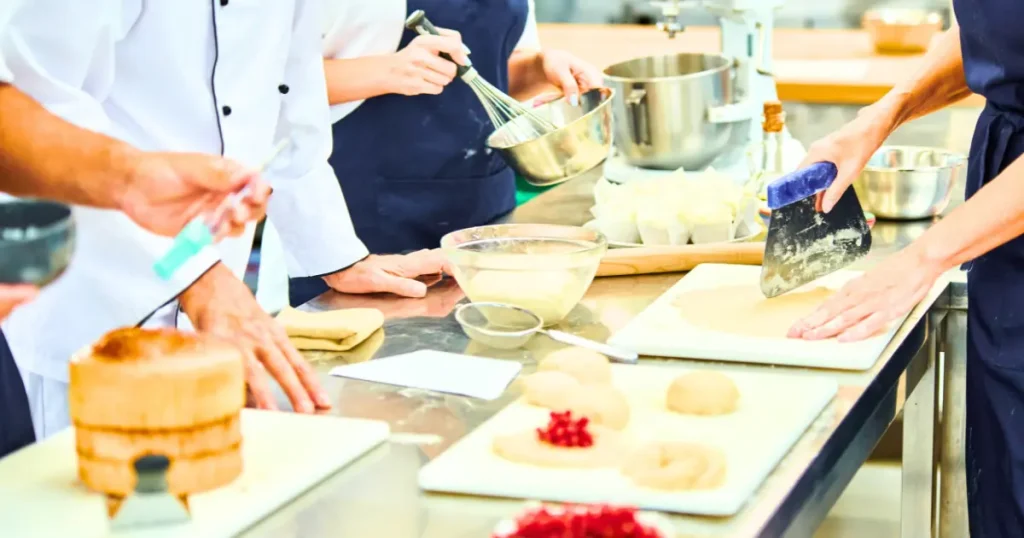 The staffing requirements for sous chefs is influenced by several factors. In metropolitan areas like Chicago with booming restaurants, both chefs and their teammates can be overwhelmed with work. Employees may also be sick, wanting to take a vacation, or dealing with family issues. This is where a temporary worker can come into the picture. There is also the next layer to this problem; having temp sous chefs guarantees that the kitchen continues to operate even when regular employees are not available.
A few of the instances where telework sous chefs are required the most are as follows:
Varying Levels of Business Activity: For some eateries that depend on seasonal business, particularly in areas with a lot of tourism, the need for additional staff can differ drastically. A temp sous chef can easily fill the gap during busy times or special occasions without the burden of a permanent position.
Certain Events: Some hotels and restaurants may need a sous chef who focuses on a specific type of cuisine. For example, a sushi restaurant may require a Sushi Chef for an event or a special training session. Keeping temp sous chefs enables kitchens to broaden their scope of hiring without being bound to a specific contract.
Absence Coverage: Absences of permanent sous chefs due to medical reasons, maternity, or sabbatical leaves can be challenging, but a skilled temporary sous chef can take over and ensure kitchen leadership during the absence.
What Effects Do Temp Sous Chefs Have On The Cookbook Industry?
Temp sous chefs have many advantages for the hospitality industry aside from plugging vacancies. These benefits include but are not limited to: